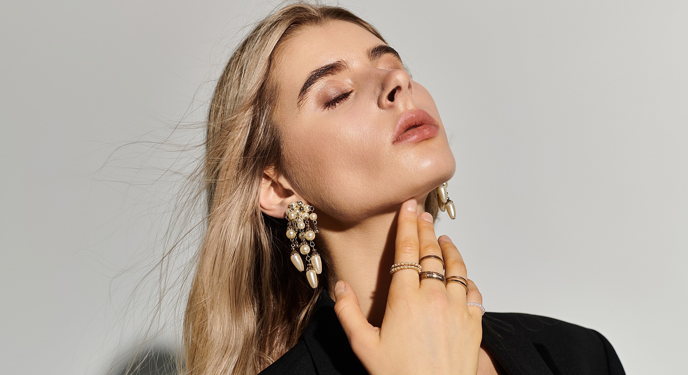 Model showcasing elegant jewelry accessories and styling.